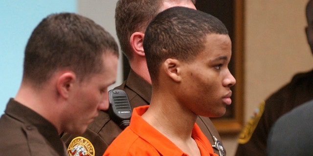 Lee Boyd Malvo listens to court proceedings during the trial of fellow sniper suspect John Allen Muhammad in Virginia Beach, Virginia Oct. 20, 2003. 