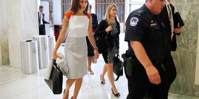 Former FBI lawyer Lisa Page, left, arrives for a closed doors interview with the House Judiciary and House Oversight committees, Monday, July 16, 2018, on Capitol Hill in Washington. (AP Photo/Jacquelyn Martin)