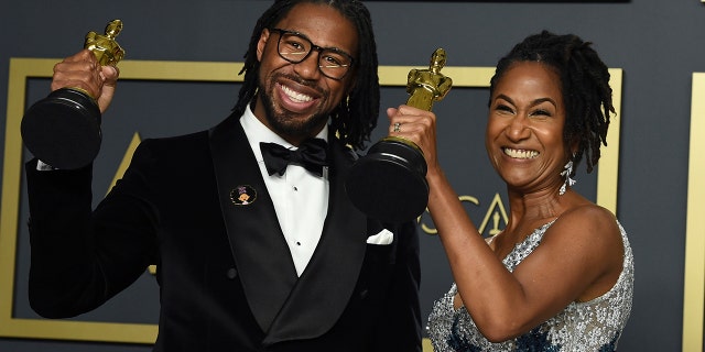 Matthew A. Cherry, left, and Karen Rupert Toliver, 2020 winners of the award for best animated short film for 'Hair Love.'