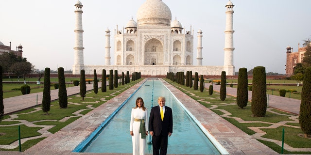 President Donald Trump, with first lady Melania Trump, pause as they tour the Taj Mahal, Monday, Feb. 24, 2020, in Agra, India. (AP Photo/Alex Brandon)