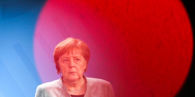 German Chancellor Angela Merkel listens to Hungary's Prime Minister Victor Orban during a joint statement prior to a meeting at the chancellery in Berlin, Germany, Monday. (AP Photo/Markus Schreiber)