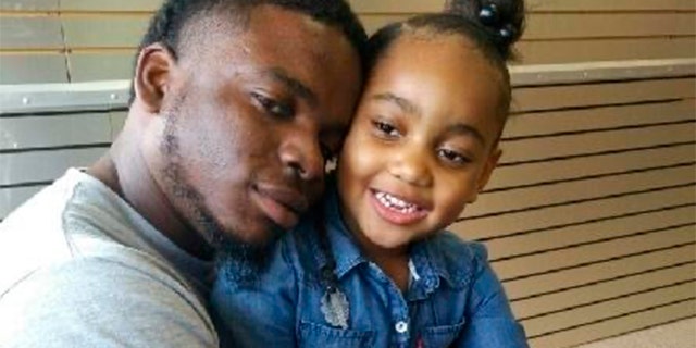 This file photo provided by the family of Michael Dean shows Dean with his daughter Te'yana. (Courtesy from Michael Dean Family via AP, File)