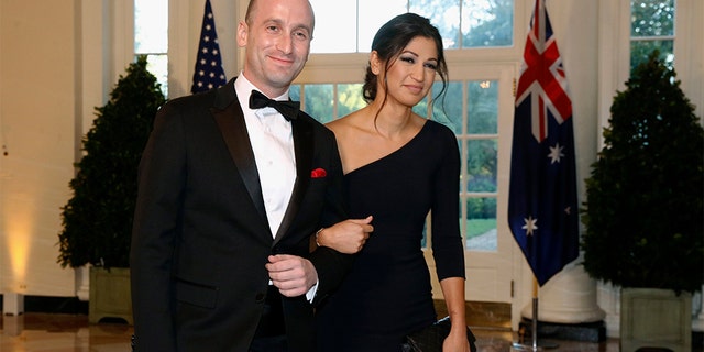 FILE - In this Sept. 20, 2019, file photo, President Donald Trump's White House Senior Adviser Stephen Miller, left, and Katie Waldman arrive for a state dinner with Australian Prime Minister Scott Morrison and Trump at the White House in Washington. (AP Photo/Patrick Semansky, File)
