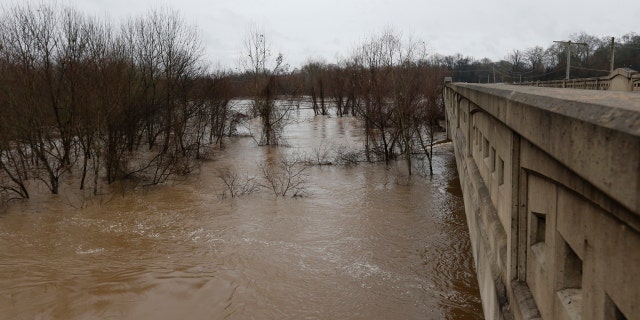 Strong currents from the swollen Pearl River push past the Old Brandon Road Bridge in Jackson, Miss., Sunday, Feb. 16, 2020.