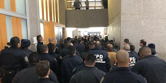 Hundreds of officers attend the arraignment of Robert Williams.