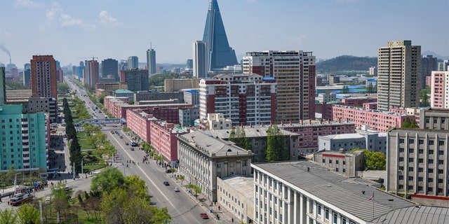 Tallest building and skyline of Pyongyang in North Korea, capital of DPRK (Democratic people republic of Korea), road, cars and skyscrapers