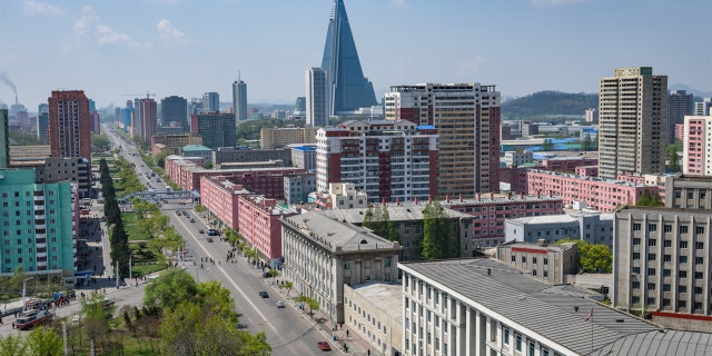 Tallest building and skyline of Pyongyang in North Korea, capital of DPRK (Democratic people republic of Korea), road, cars and skyscrapers