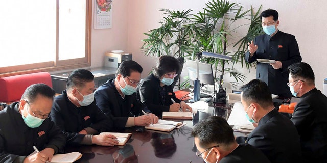 In this undated photo distributed on Wednesday, Feb. 12, 2020, by the North Korean government, North Korean Premier Kim Jae Ryon, right top, has a meeting at the emergency anti-epidemic headquarter in Pyongyang, North Korea. Independent journalists were not given access to cover the event depicted in this image distributed by the North Korean government. The content of this image is as provided and cannot be independently verified. (Korean Central News Agency/Korea News Service via AP)