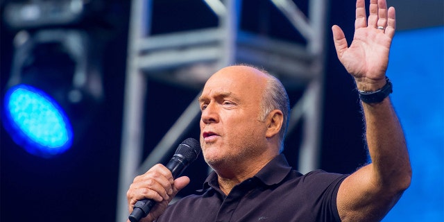 Pastor Greg Laurie speaks to thousands of faithful during the first night of the 26th Annual Harvest Crusade at Angel Stadium.(Photo by Leonard Ortiz/Digital First Media/Orange County Register via Getty Images)