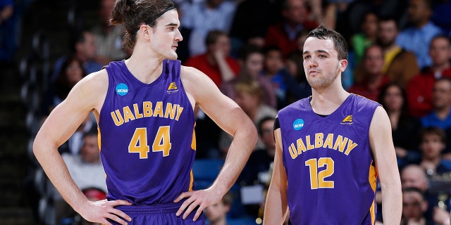 Peter Hooley, right, won a pair of conference tournament MVPs during his time at Albany. (Photo by Joe Robbins/Getty Images)