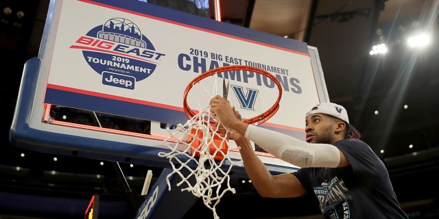 Phil Booth #5 of the Villanova Wildcats cuts down the net after the 74-72 win over the Seton Hall Pirates after the Big East Championship Game at Madison Square Garden on March 16, 2019 in New York City. (Photo by Elsa/Getty Images)