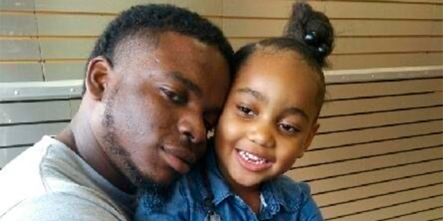 This file photo provided by the family of Michael Dean shows Dean with his daughter Te'yana. (Courtesy from Michael Dean Family via AP, File)