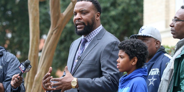 In this Monday, Feb. 10, 2020, photo, Lee Merritt, left, the Dean family's attorney, calls for a higher charge hours after Temple Police Officer Carmen DeCruz was charged with manslaughter in the fatal shooting on Dec. 2 of 28-year-old Michael Dean.? (Joel Valley/The Temple Daily Telegram via AP)