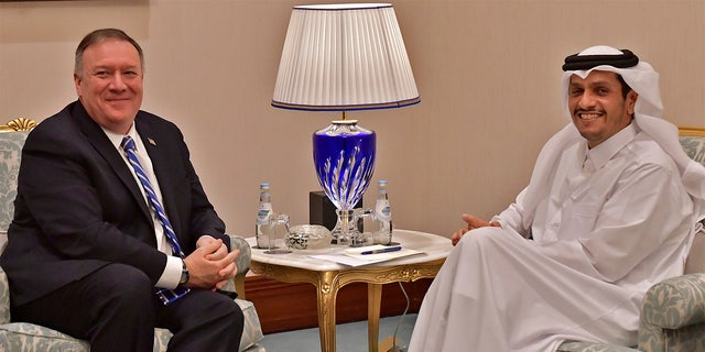 From left, U.S. Secretary of State Mike Pompeo meets with Qatar's Foreign Minister Sheikh Mohammed bin Abdulrahman Al Thani before a peace signing ceremony between the U.S. and the Taliban in Doha on Saturday, Feb. 29, 2020. The U.S. is poised to sign a peace agreement with Taliban militants on Saturday aimed at bringing an end to 18 years of bloodshed in Afghanistan and allowing U.S. troops to return home from America's longest war. (Giuseppe Cacace/Pool photo via AP)