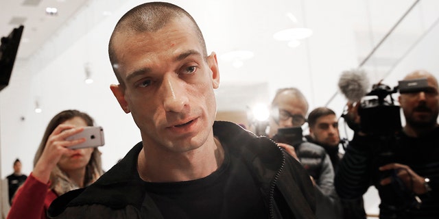 Russian performance artist Pyotr Pavlensky arrives at the Paris courthouse in January 2019 as he goes on trial for setting fire to the facade of France's central bank.