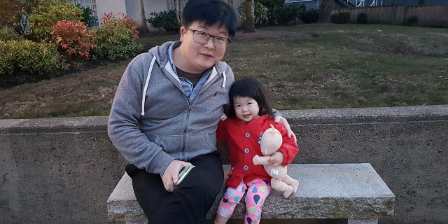 Wei Ye and his 2-year-old daughter Cerena who is stranded in China's Hubei province are seen in this undated handout photo. 