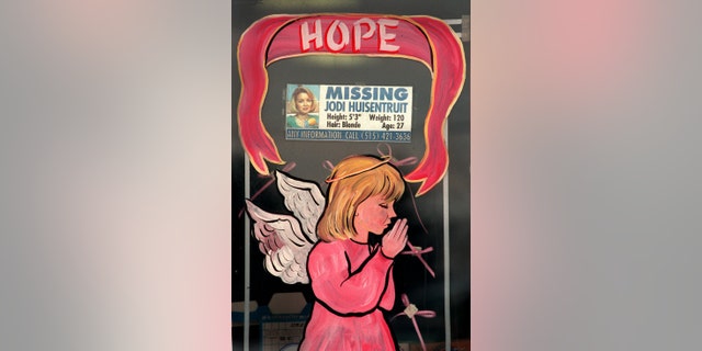 Merchants in Long Prairie decorated their store windows with angels dressed in pink. The message of the season was hope, which many thought of as hope for Jodi Huisentruit, the hometown girl who is still missing. Some merchants incorporated missing posters of Huisentruit into their holiday display. The photo was taken on 1/12/96.