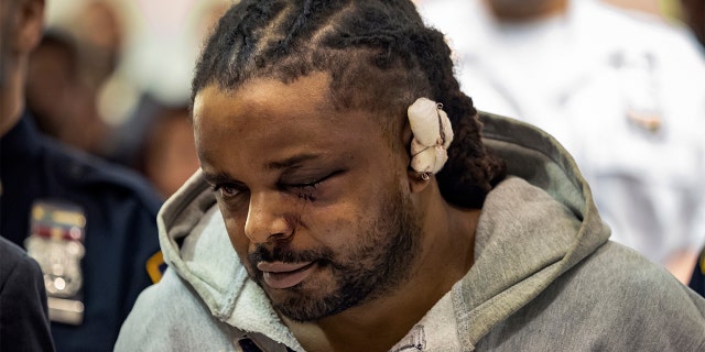 Robert Williams is arraigned in Bronx Criminal Court Monday, Feb. 10, 2020, in New York. The 45-year-old was charged with attempted murder, criminal weapon possession and resisting arrest after he ambushed police officers in the Bronx twice in 12 hours wounding two in attacks, authorities said. (Anthony Del Mundo vía AP, Pool)