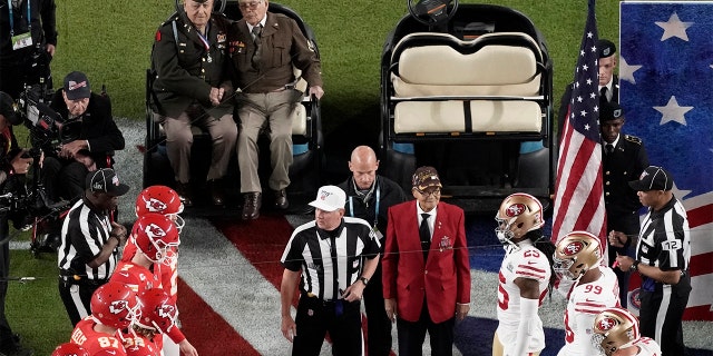 Armed Forces veterans participate during the coin toss before the NFL Super Bowl 54 football game Sunday, Feb. 2, 2020, in Miami Gardens, Fla. (AP Photo/Morry Gash)