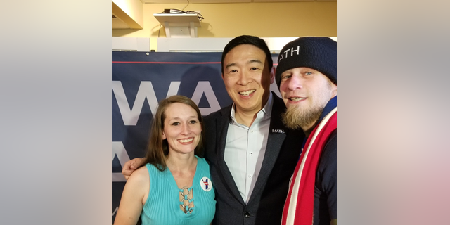 Russell Peterson and his wife Elasa pose for a picture with Andrew Yang. (Photo provided by Russell Peterson)