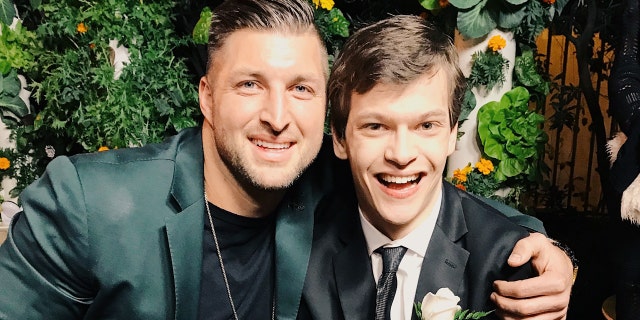 Micah Fowler and Tim Tebow at Zoe Church’s 'Night to Shine' on Feb 8th, 2019.