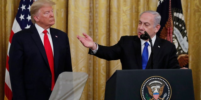Israeli Prime Minister Benjamin Netanyahu speaks during an event with President Donald Trump in the East Room of the White House in Washington, Tuesday, Jan. 28, 2020, to announce the Trump administration's much-anticipated plan to resolve the Israeli-Palestinian conflict. (AP Photo/Alex Brandon)