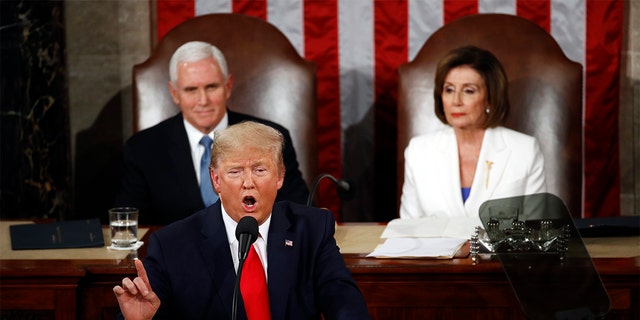 President Donald Trump delivers his State of the Union address to a joint session of Congress on Capitol Hill in Washington, Tuesday, Feb. 4, 2020, as Vice President Mike Pence and House Speaker Nancy Pelosi, D-Calif., watch.