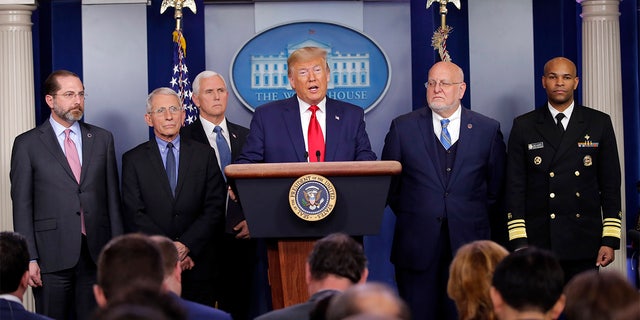 President Donald Trump speaks about the coronavirus in the press briefing room at the White House, Feb. 29, in Washington as Health and Human Services Secretary Alex Azar, National Institute for Allergy and Infectious Diseases Director Dr. Anthony Fauci, Vice President Mike Pence, Robert Redfield, director of the Centers for Disease Control and Prevention and U.S. Surgeon General Dr. Jerome Adams listen. (AP Photo/Carolyn Kaster)