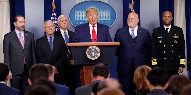 President Donald Trump speaks about the coronavirus in the press briefing room at the White House, Saturday, Feb. 29, 2020, in Washington as Health and Human Services Secretary Alex Azar, National Institute for Allergy and Infectious Diseases Director Dr. Anthony Fauci, Vice President Mike Pence, Robert Redfield, director of the Centers for Disease Control and Prevention and U.S. Surgeon General Dr. Jerome Adams listen. (AP Photo/Carolyn Kaster)