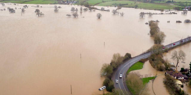 Flood water inundates fields around the town of Upton-upon-Severn, England, after the river Severn burst its banks, in the aftermath of Storm Dennis.