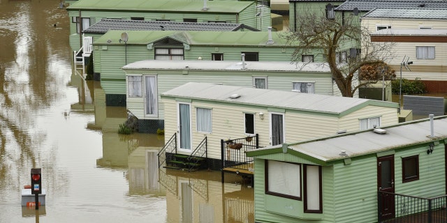 The Riverside Caravan Park is inundated by flood water after heavy rains breached the nearby river Severn and normal watercourses in the area of Bridgnorth, England, Wednesday Feb. 19, 2020.