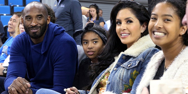 Los Angeles Lakers legend Kobe Bryant, his daughter Gianna Maria-Onore Bryant, wife Vanessa and daughter Natalia Diamante Bryant are seen before a Connecticut-UCLA NCAA women's basketball game in Los Angeles, Nov. 21, 2017.  (Associated Press)