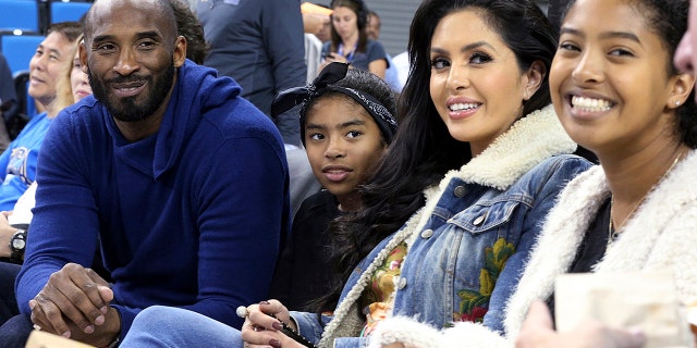 Los Angeles Lakers legend Kobe Bryant, his daughter Gianna Maria-Onore Bryant, wife Vanessa and daughter Natalia Diamante Bryant are seen before a Connecticut-UCLA NCAA women's basketball game in Los Angeles, Nov. 21, 2017.  (Associated Press)