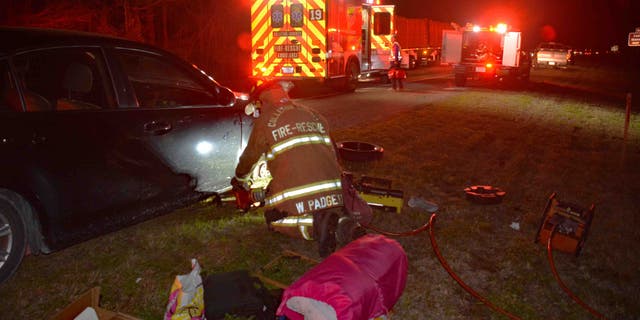 Fire crews deployed a Holmatro Hydraulic Spreader to lift the car and free her