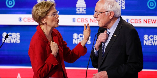From left, Democratic presidential hopefuls Sen. Elizabeth Warren, D-Mass., left, speaks with Sen. Bernie Sanders, I-Vt., right, onstage after the Democratic presidential primary debate Tuesday, Feb. 25, 2020. (AP Photo/Patrick Semansky)