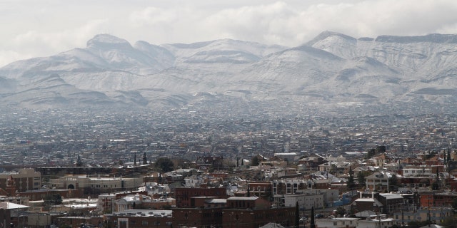 Snow obscures writing on the side of the mountains above Ciudad Juarez, Mexico, as seen from El Paso, Texas, on Wednesday, Feb. 5, 2020.