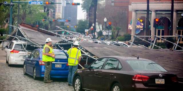 A portion of scaffolding is on top of cars at the former World Trade Center construction site after severe weather in New Orleans, La., Wednesday, Feb. 5, 2020.