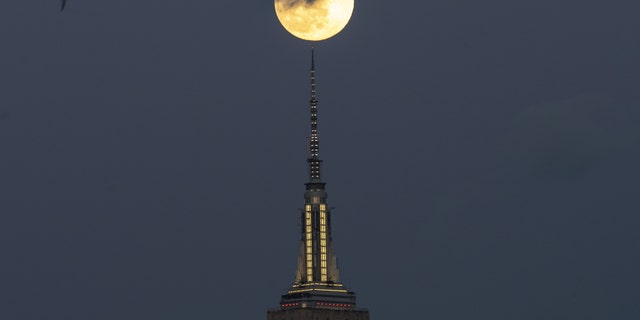 Full Snow Moon rises over the Empire State Building in New York City, United States on February 8, 2020.