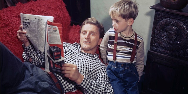 Kirk Douglas with his son Michael, who would also go on to become a legendary actor. (Photo by Sunset Boulevard/Corbis via Getty Images)