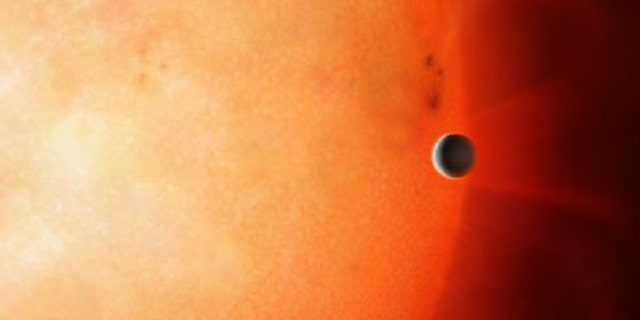 Artist’s impression of a hot Jupiter orbiting close to a star. (Credit: University of Warwick/Mark Garlick)