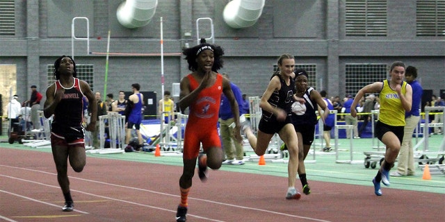 FILE - In this Feb. 7, 2019, file photo, Bloomfield High School transgender athlete Terry Miller, second from left, wins the final of the 55-meter dash over transgender athlete Andraya Yearwood, far left, and other runners in the Connecticut girls Class S indoor track meet at Hillhouse High School in New Haven, Conn. Miller and Yearwood are among Connecticut transgender athletes who would be blocked from participating in girls sports under a federal lawsuit filed Wednesday, Feb. 12, 2020, by the families of three athletes. (AP Photo/Pat Eaton-Robb, File)