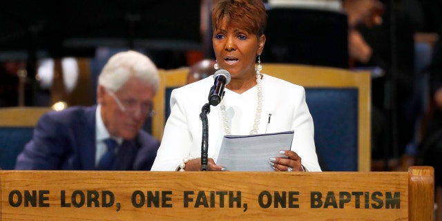 Sabrina Owens reads the obituary during the funeral service for Aretha Franklin at Greater Grace Temple in Detroit. Owens, Franklin's niece, said she's quitting as representative of the late singer's estate, citing a rift in the family since handwritten wills were discovered last year.