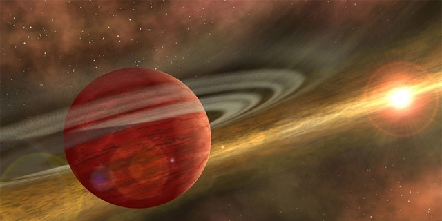 Artist's conception of a massive planet orbiting a cool, young star. In the case of the system discovered by RIT astronomers, the planet is 10 times more massive than Jupiter, and the orbit of the planet around its host star is nearly 600 times that of Earth around the sun. NASA/JPL-Caltech/R. Hurt (SSC-Caltech)