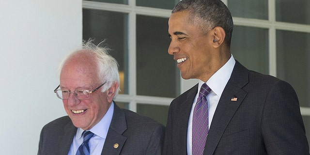 President Barack Obama walks with Democratic presidential candidate Sen. Bernie Sanders, I-Vt., down the Colonnade of the White House in Washington, Thursday, June 9, 2016. (AP Photo/Pablo Martinez Monsivais)