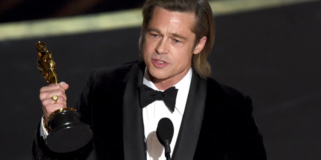 Brad Pitt accepts the award for best performance by an actor in a supporting role for 'Once Upon a Time in Hollywood' at the Oscars on Sunday, Feb. 9, 2020, at the Dolby Theatre in Los Angeles.