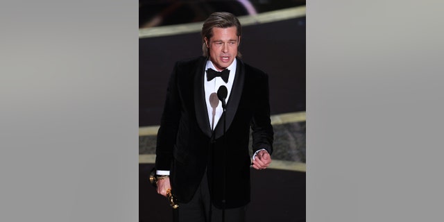 Brad Pitt accepts the actor in a supporting role award for 'Once Upon a Time...in Hollywood' onstage during the 92nd Annual Academy Awards.
