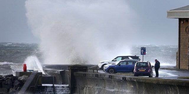Waves batter the coastline at Saltcoats, North Ayrshire, Scotland, Sunday, Feb. 9, 2020.