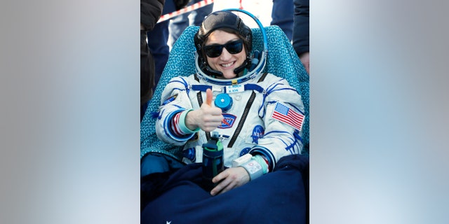 U.S. astronaut Christina Koch gestures shortly after the landing of the Russian Soyuz MS-13 space capsule about 150 km ( 80 miles) south-east of the Kazakh town of Zhezkazgan, Kazakhstan, Thursday, Feb. 6, 2020. (Sergei Ilnitsky/Pool Photo via AP)