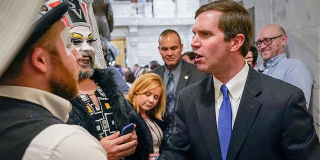 Kentucky Democratic Gov. Andy Beshear greets members of the Kentucky Order of the Sisters of Perpetual Indulgence, an LGBTQ charity group, following an LGBTQ rally at the Capitol building in Frankfort, Ky., Feb. 19, 2020. (Associated Press)