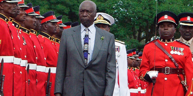 Kenya President Daniel arap Moi inspects a guard of honor at a barracks in Nairobi, Kenya during a 2002 parade by the armed forces in honor of the leader.